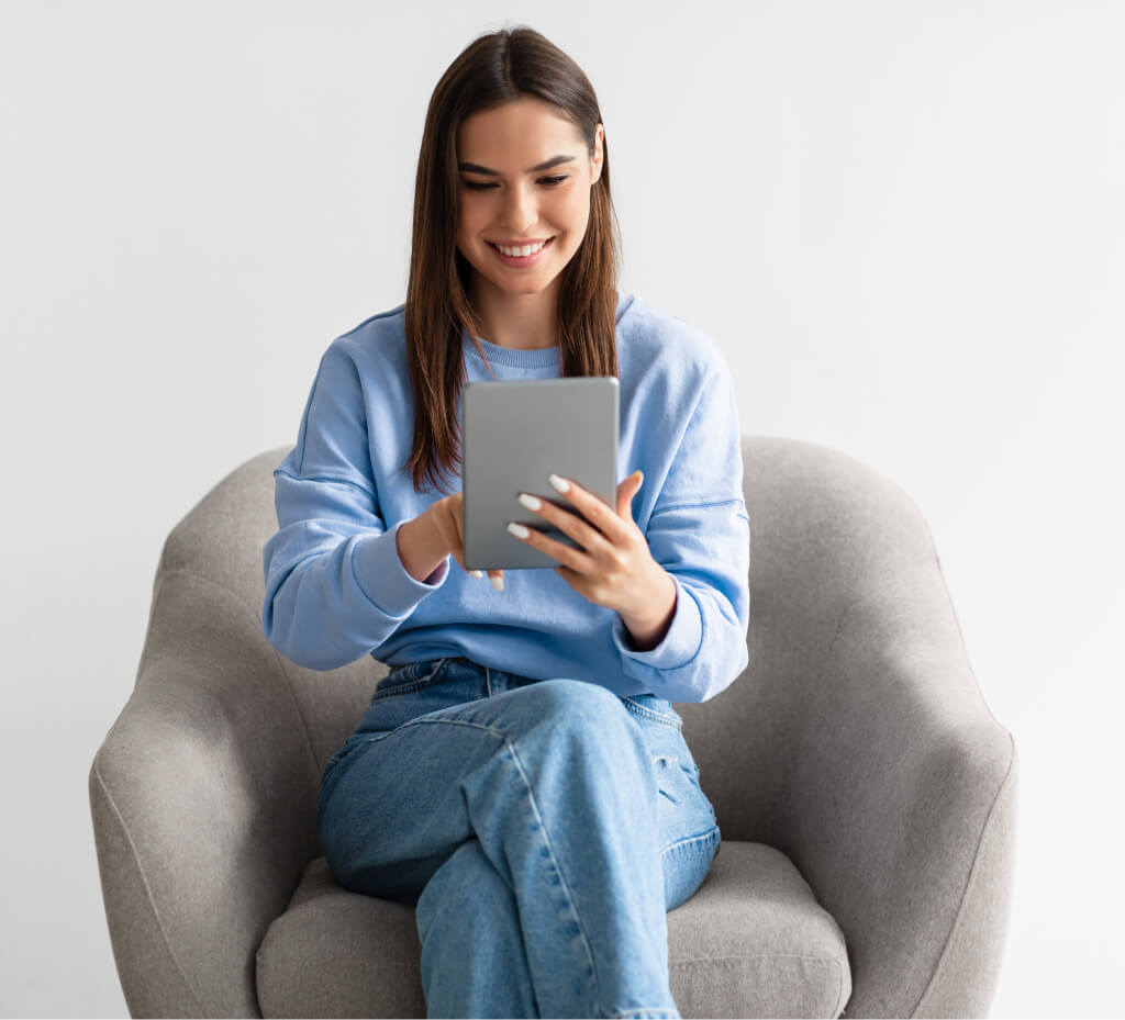 young-caucasian-woman-using-digital-tablet-browsi-2021-12-09-08-12-48-utc-1